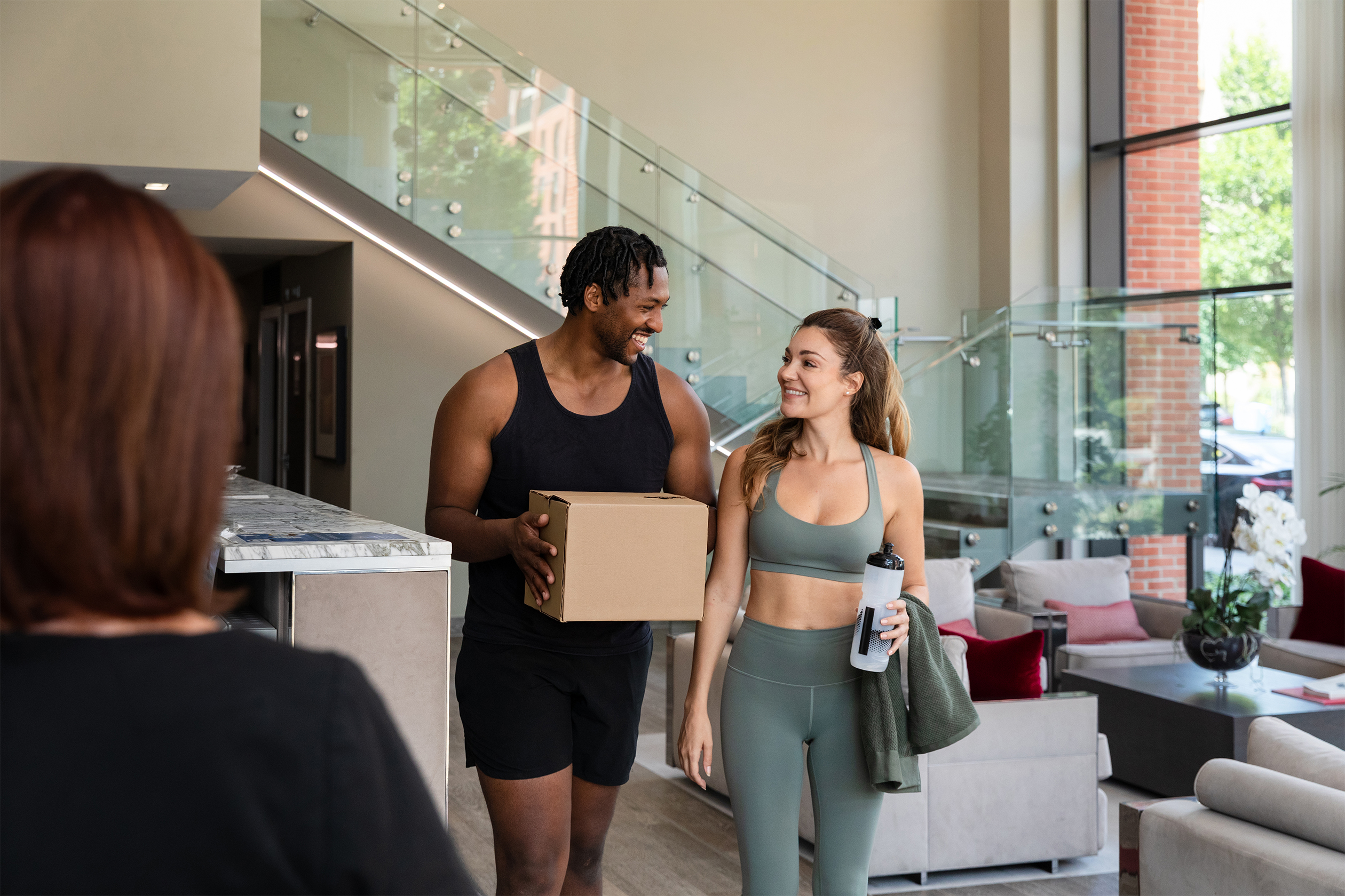 Couple approaching concierge desk