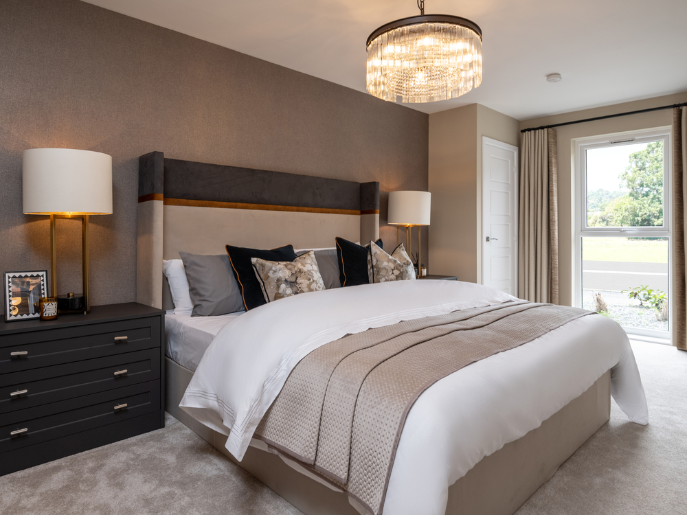 Image of bedroom with chest side table, and floor to ceiling window in a 2 bedroom apartment at Stonehaven Park