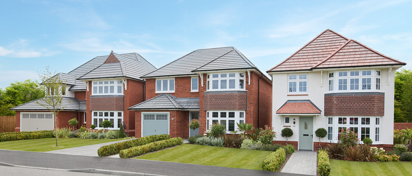 Two semi-detached houses with brick and white exteriors, well-maintained gardens, and a bright blue sky in Woburn View at Woburn View.