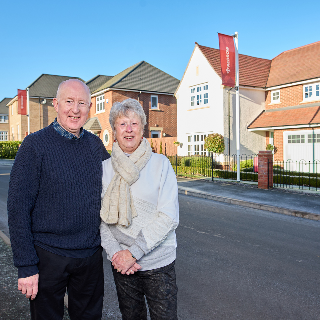 Robert & Janet outside their Redrow home