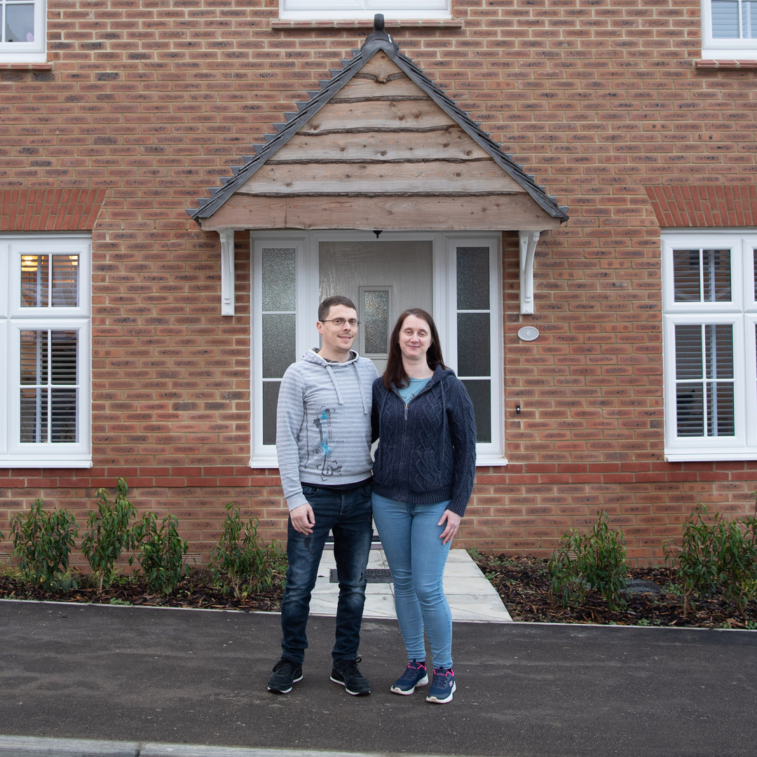 Tom, Cathy & family in their new home