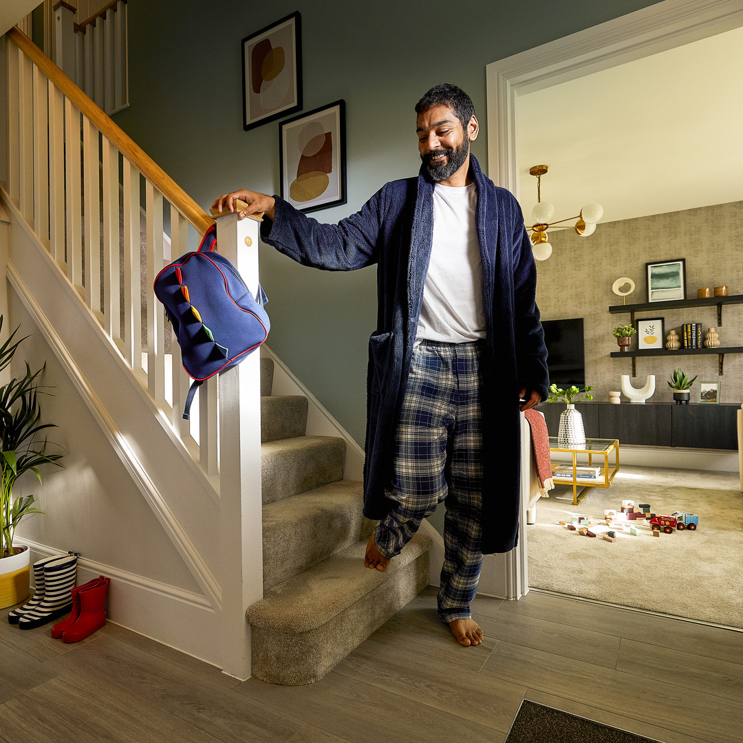  Man stepping off the stairs onto underfloor heating
