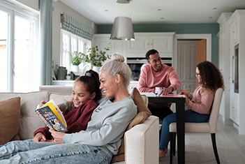 Family relaxing in spacious open plan living area
