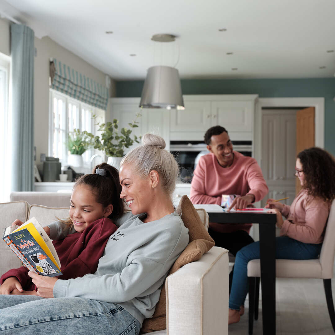 Family relaxing in spacious open plan living area
