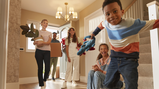 Excited family moving into their new home