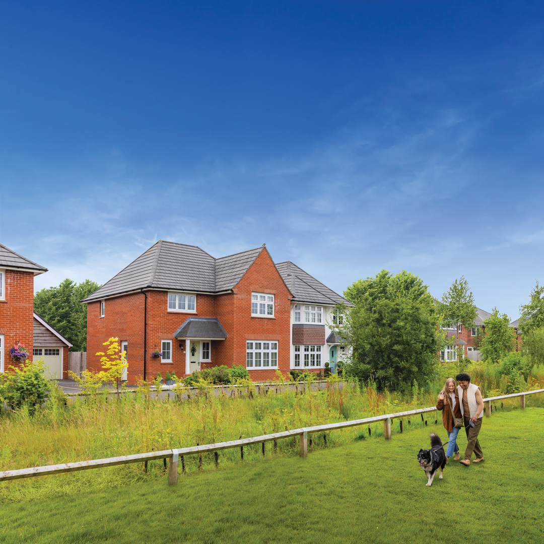 Couple walking dog at Cranberry Gardens