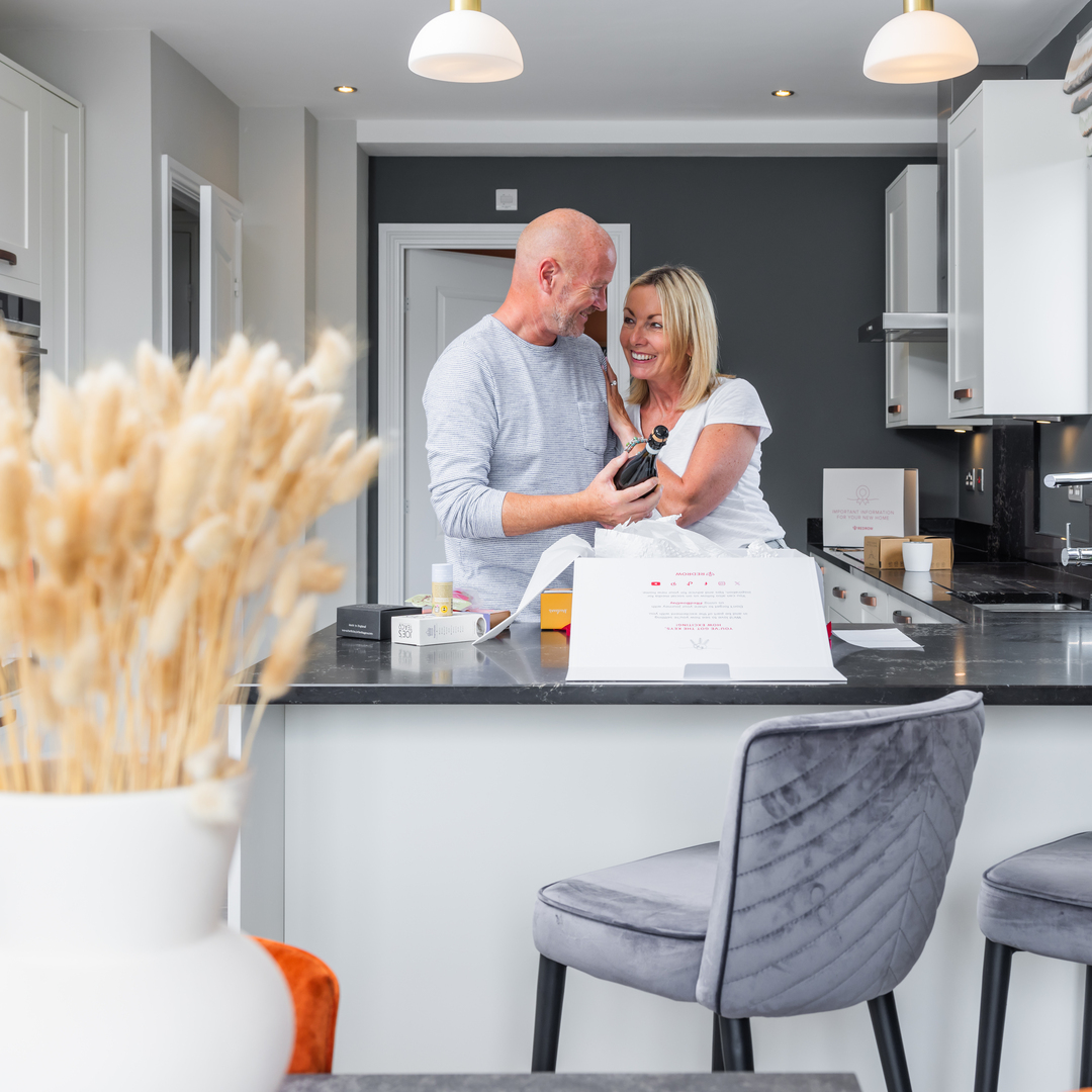 Couple receive their Redrow welcome pack