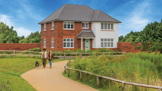 Couple taking a walk with their dog past The Shaftesbury