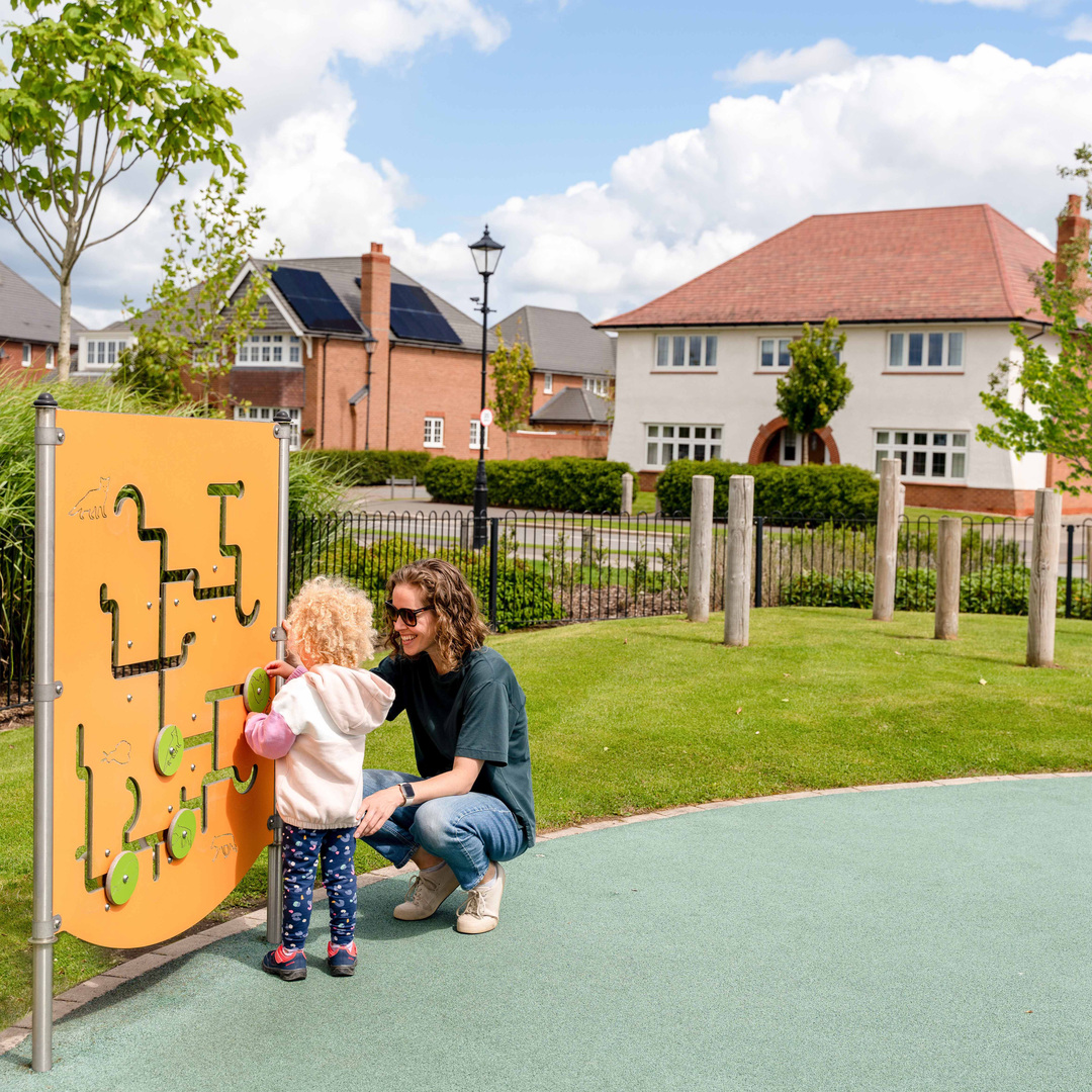 Mother and child playing in Woodford Garden Village