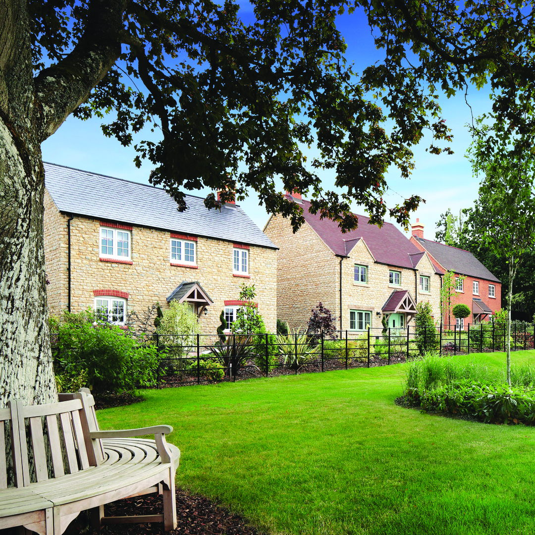 Inspired Collection - Tree with bench wrap around in front of Inspired homes