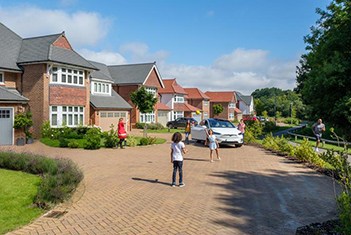 Children playing outside Heritage homes