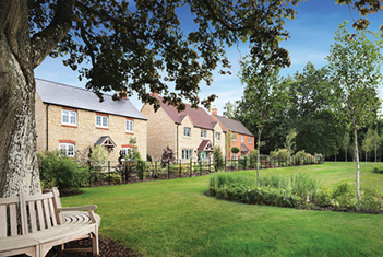 Tree with bench wrap around in front of Inspired homes