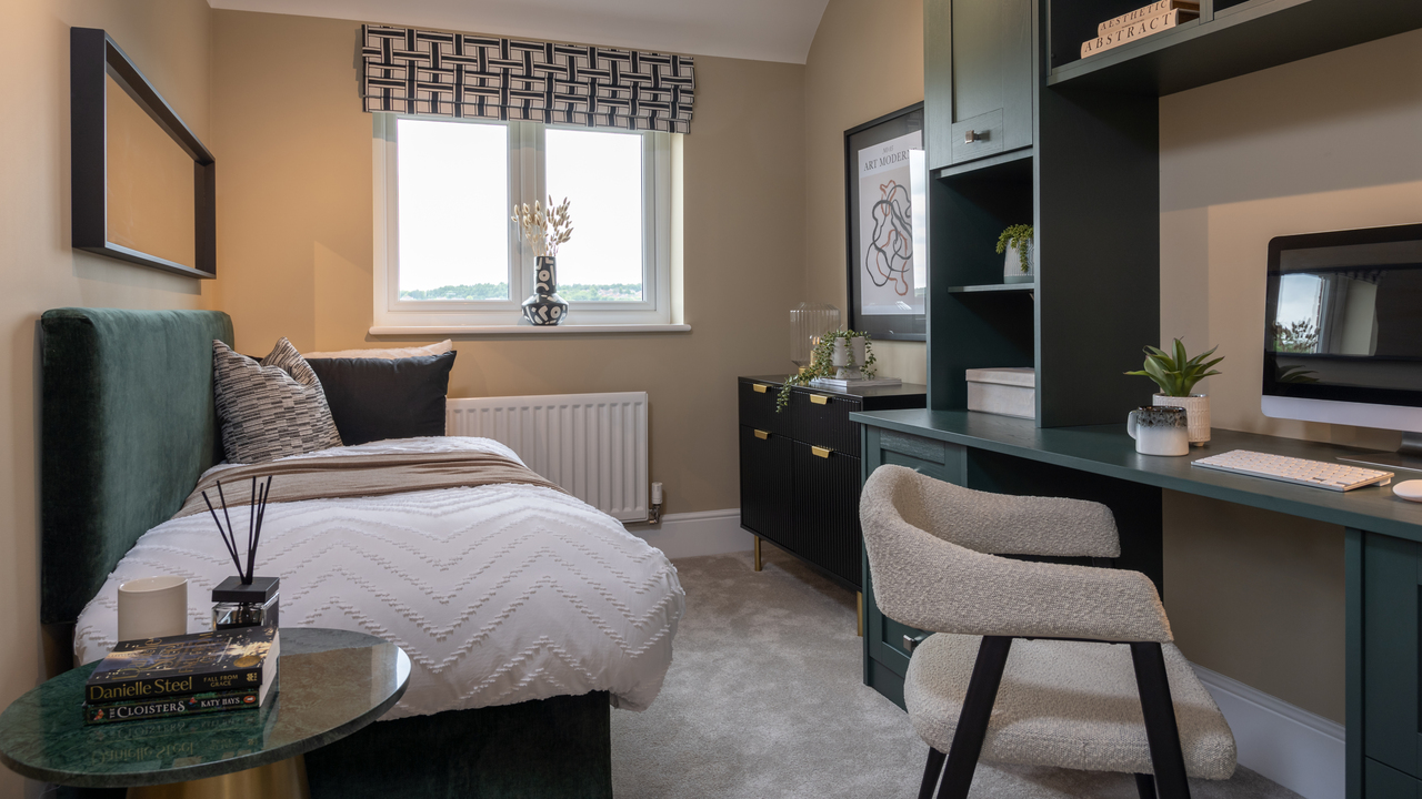 Stylish home office with fitted desk and single bed