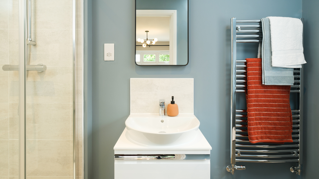 Bathroom with heated towel rail and tabletop sink