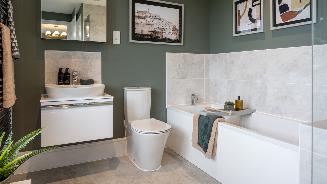 Bathroom with green walls and marble splashbacks