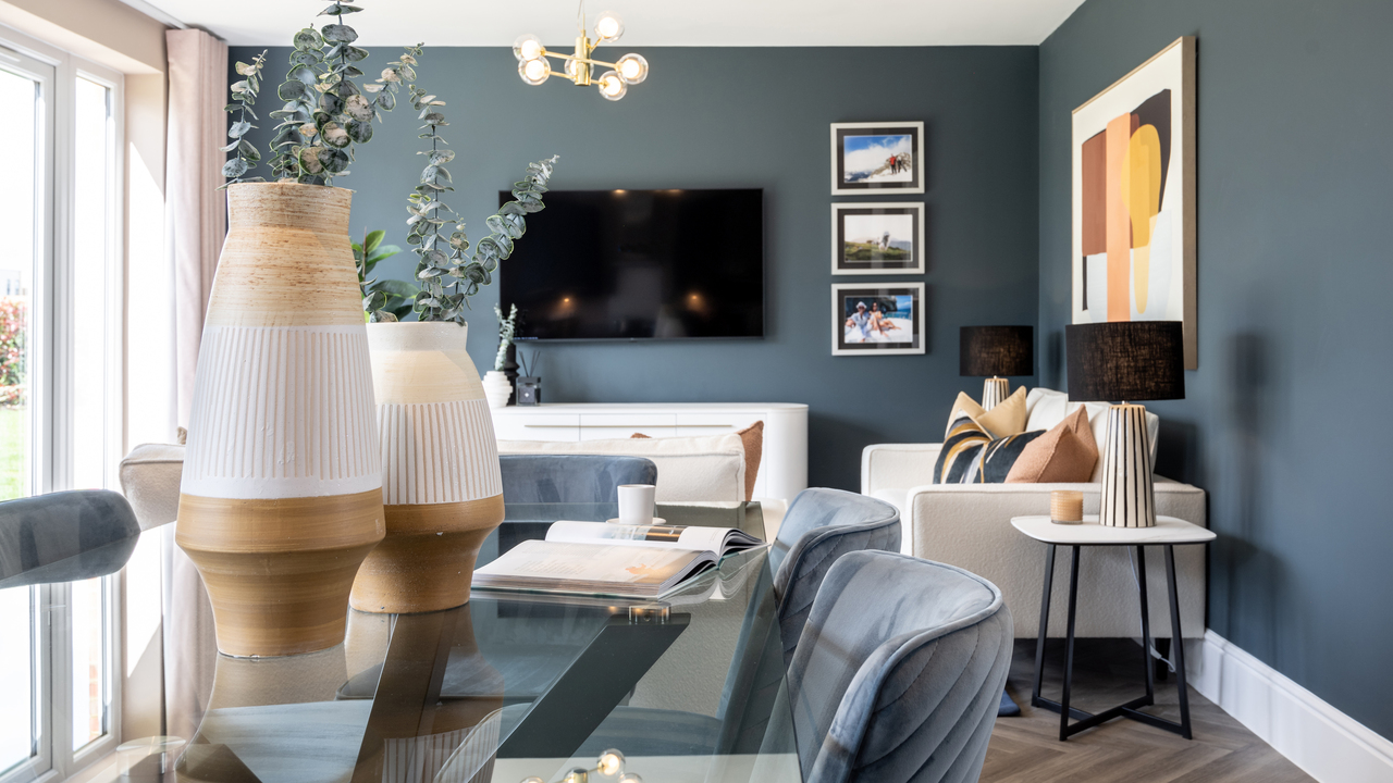 Dining and family area with dark blue walls