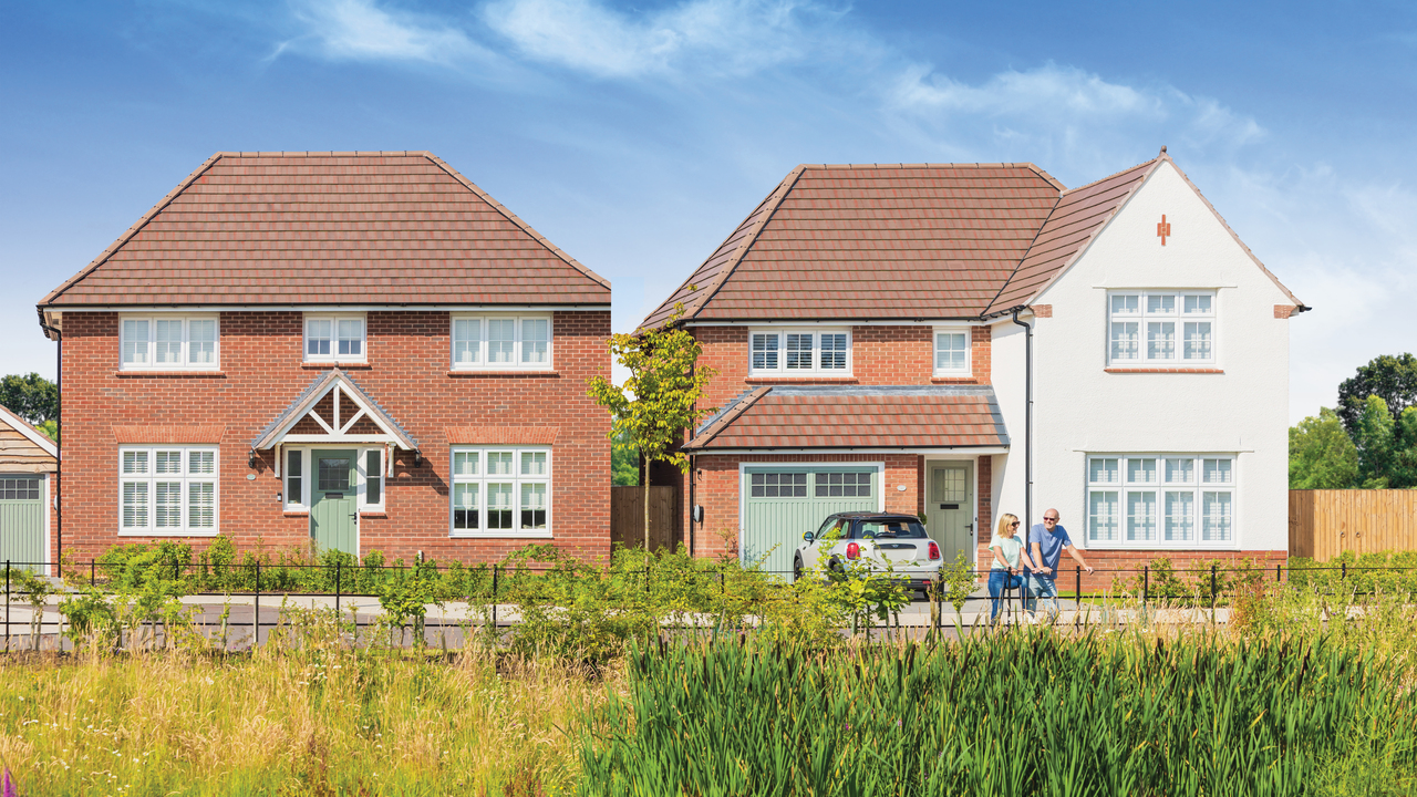 Two Heritage homes behind open green space