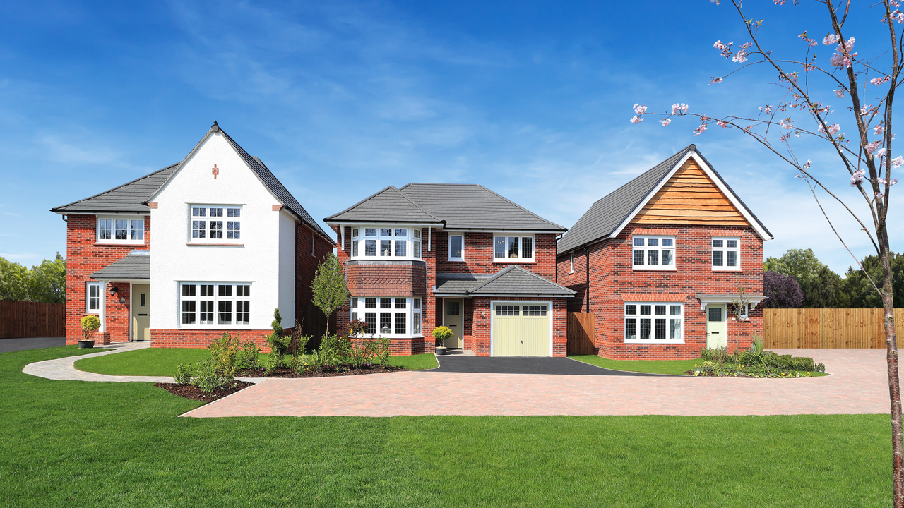 Three detached Heritage homes under a clear blue sky