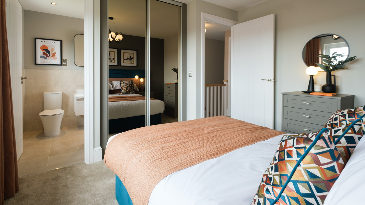 Bedroom with double bed, mirrored wardrobes and en-suite visible 