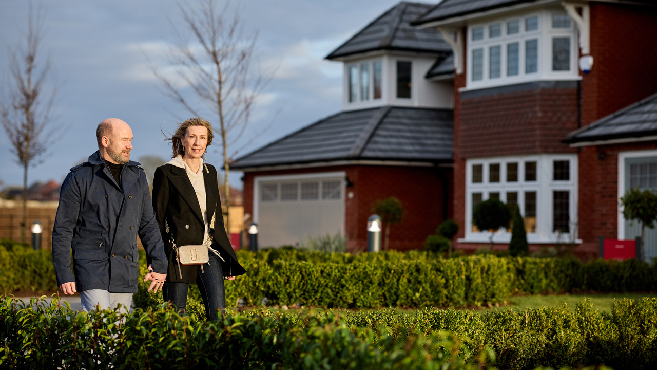 Redrow - Inspiration - Couple walking through Redrow show homes