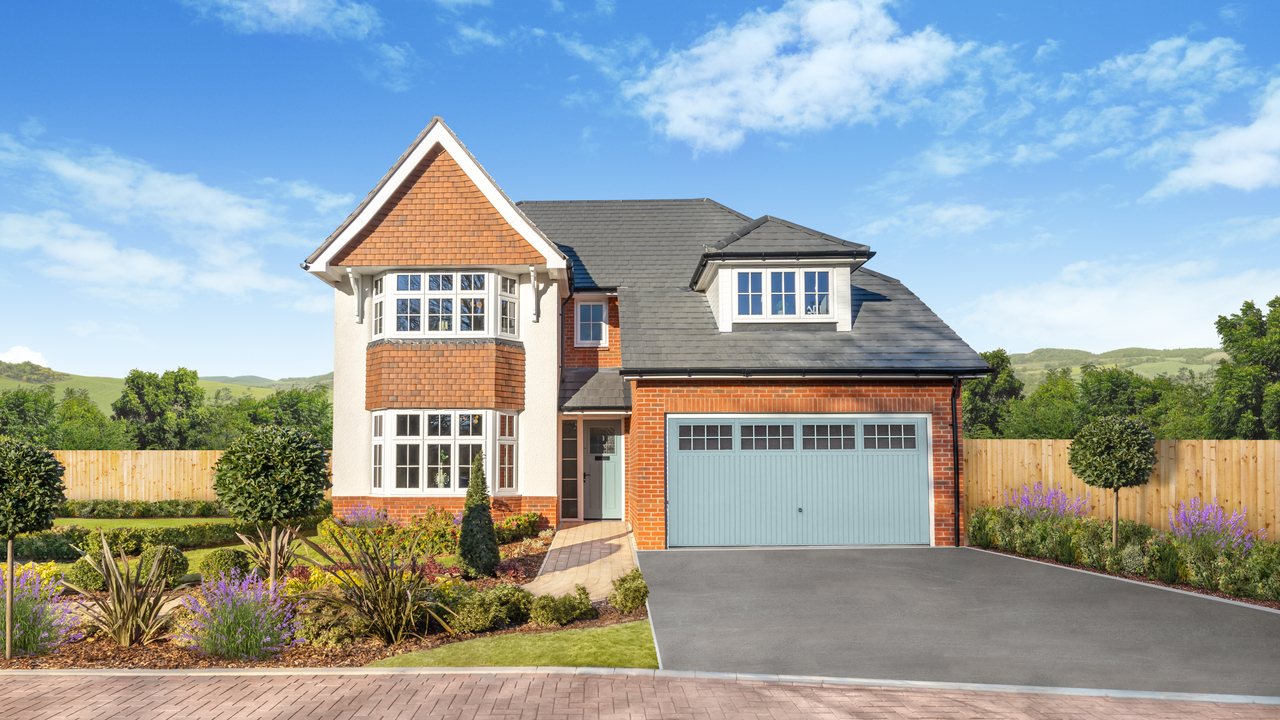 Large detached house with  blue garage door and well-manicured front garden