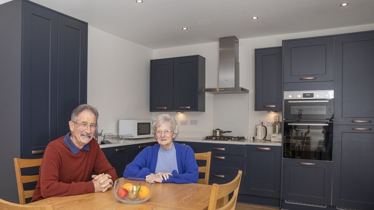 Valerie and Martin in the kitchen of their three-bedroom Warwick home