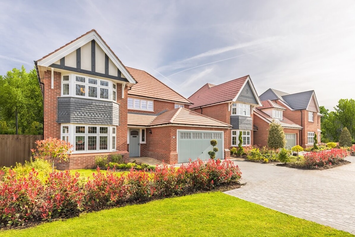 A street scene of a premium Redrow home at a sunny day