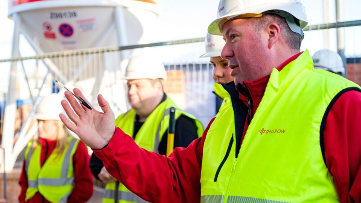 A group of construction workers having a meeting