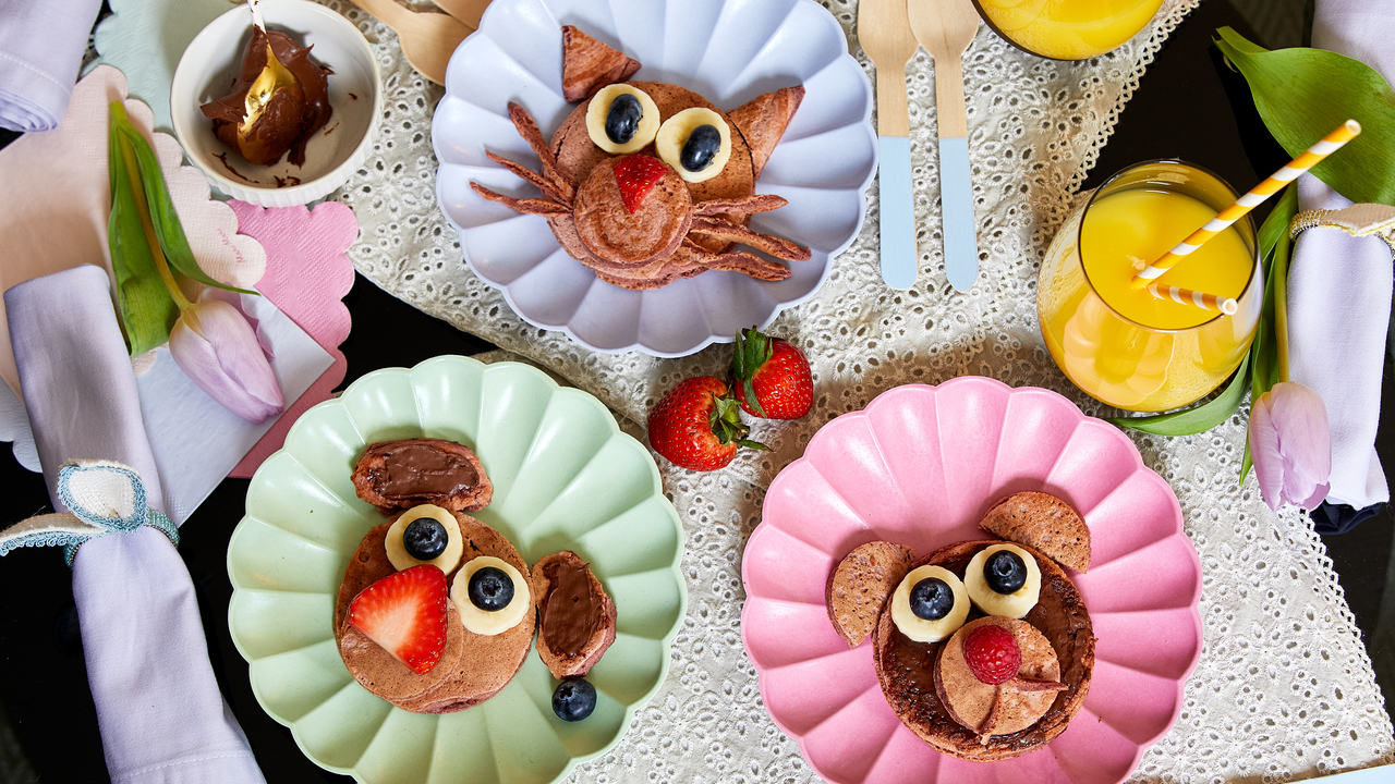 Pancakes made to look like animals on colourful plates