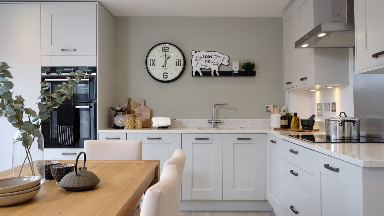 Shaker-style kitchen with pale green walls