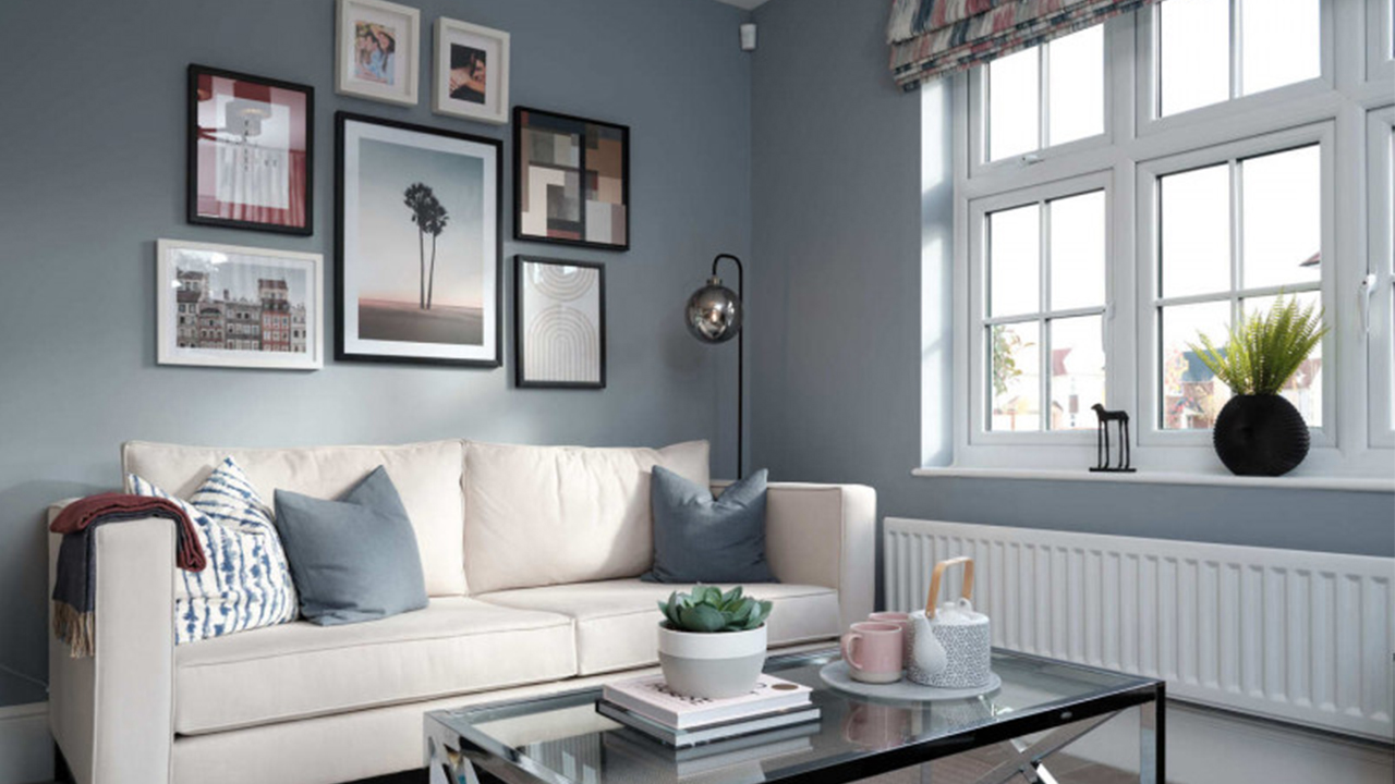 Lounge with blue walls and white sofa