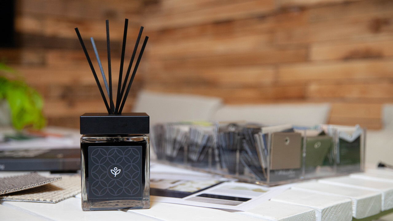 Black reed diffuser with Redrow branding