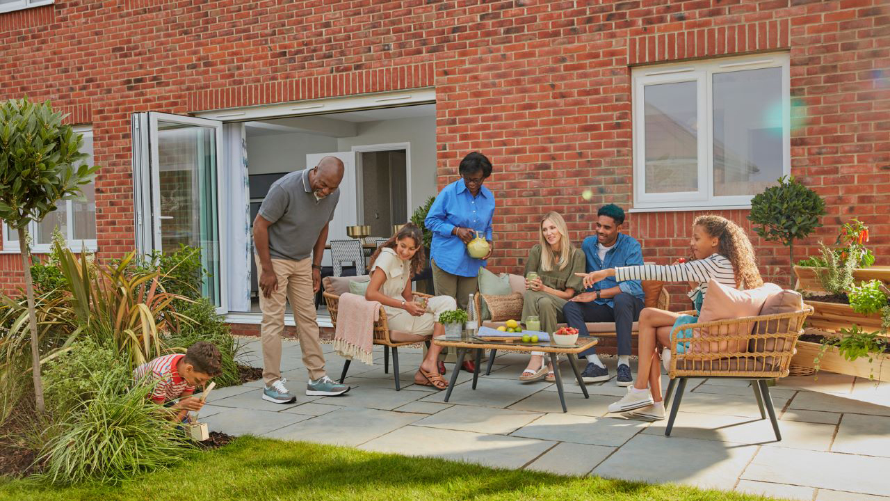 Family enjoying some drinks in their garden