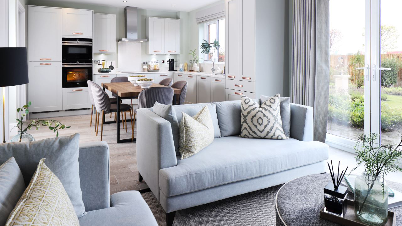 Open plan kitchen dining and family area with large patio doors leading to the garden