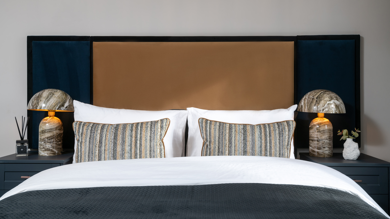 Bed with marble bedside lamps