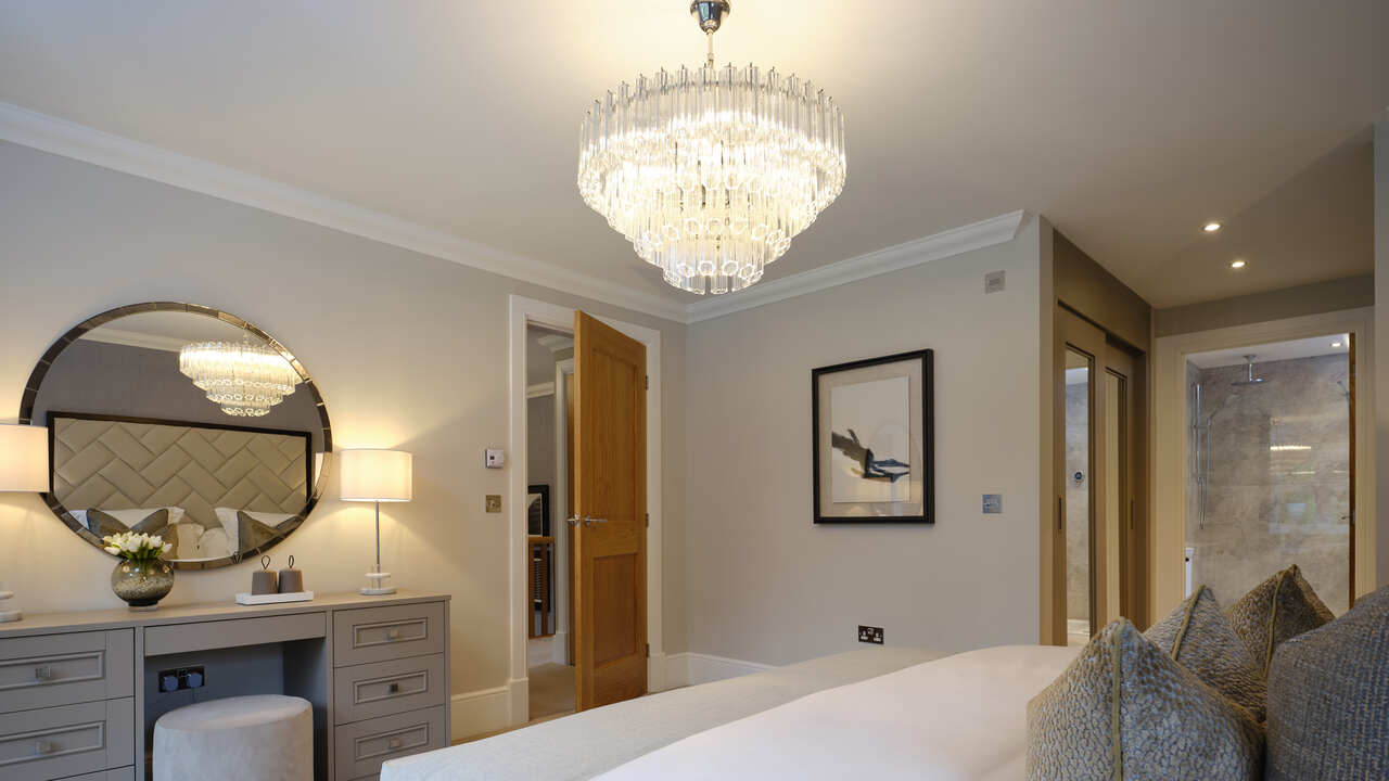 Bedroom with large chandelier