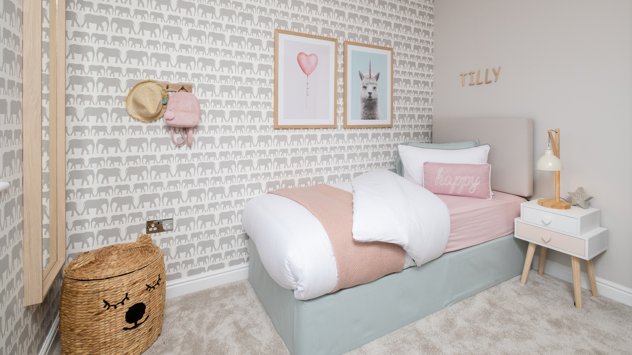 Animal-themed bedroom with elephant patterned wallpaper