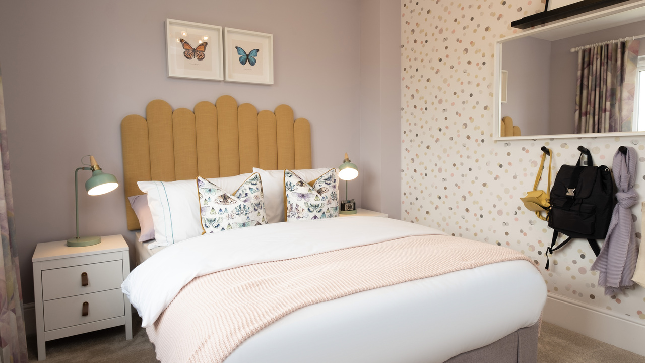 Bedroom with butterfly artwork