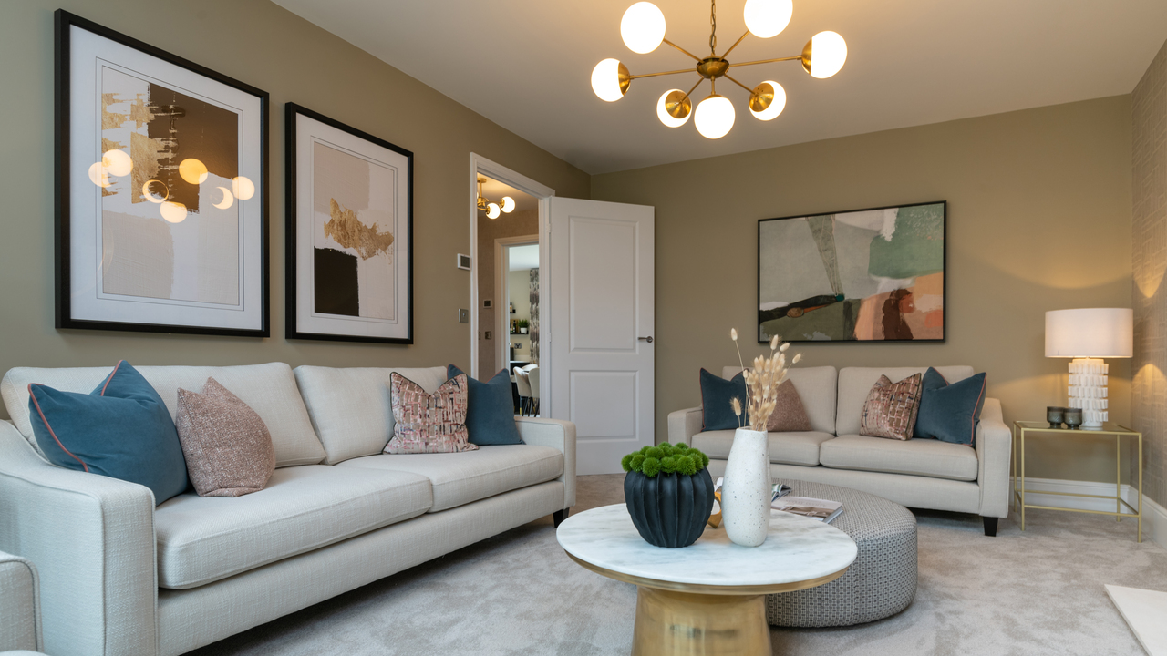 Lounge with three large artworks in similar tones