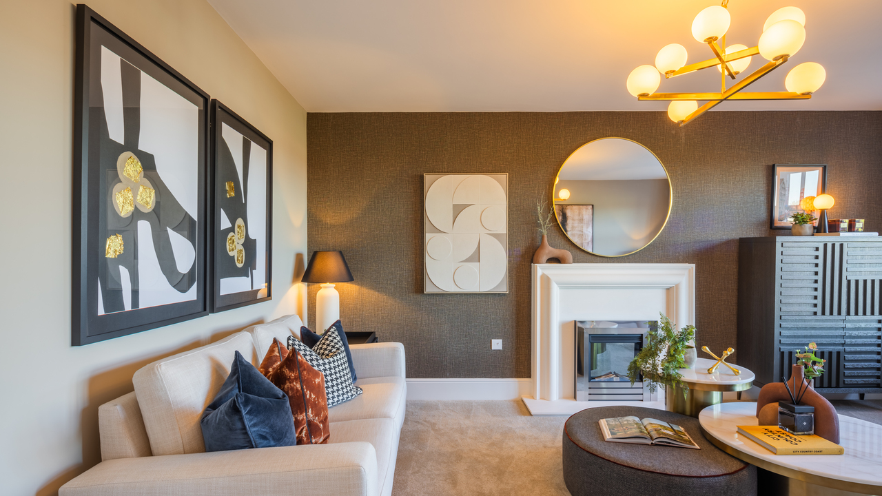 Lounge with round mirror over a white fireplace