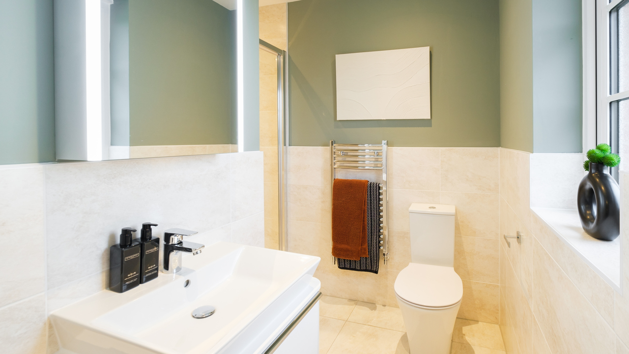 Luxury hotel style bathroom with heated towel rack