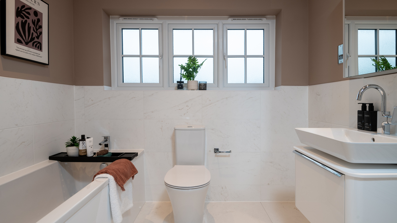 Modern bathroom featuring a wooden bath rack