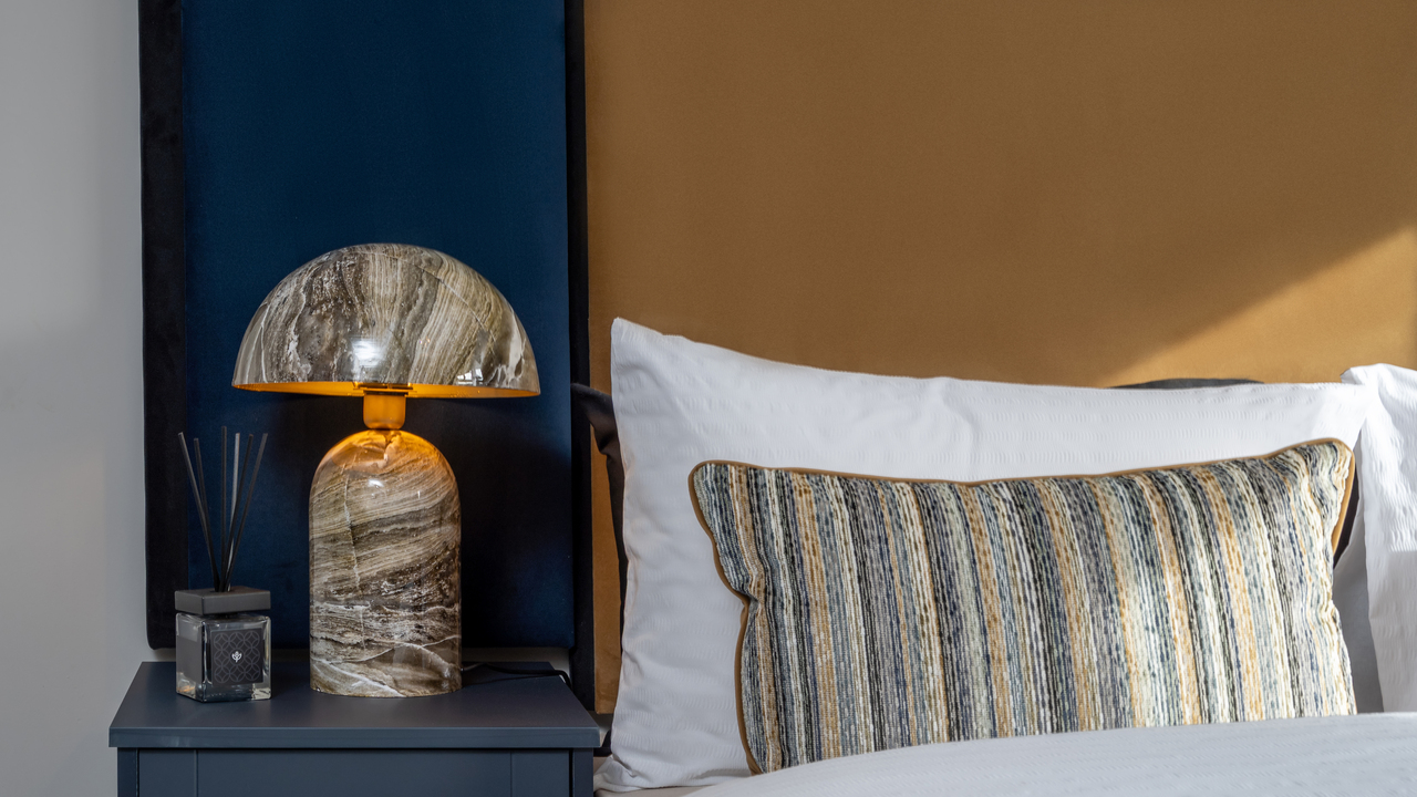 Bed with bedside marble lamp