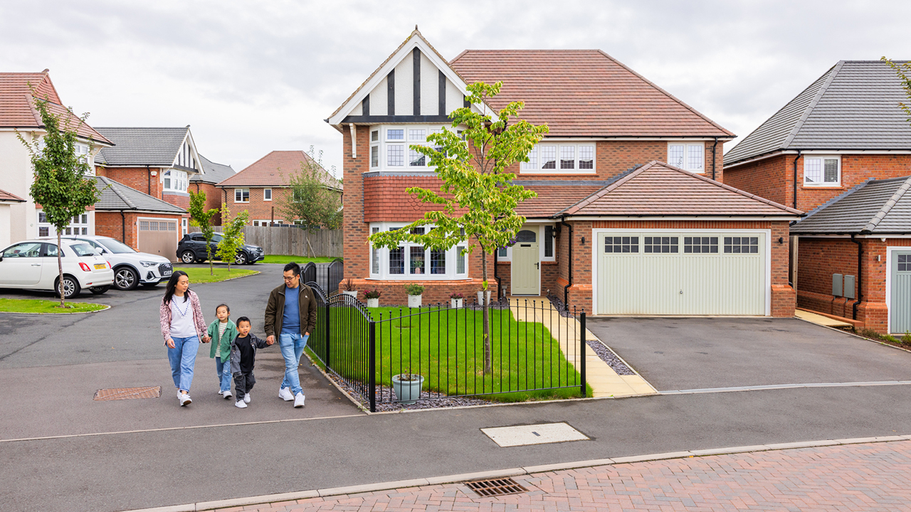 Family walking through a Redrow development