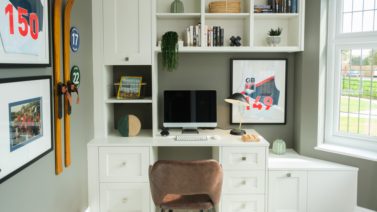 Home office with built in desk and storage