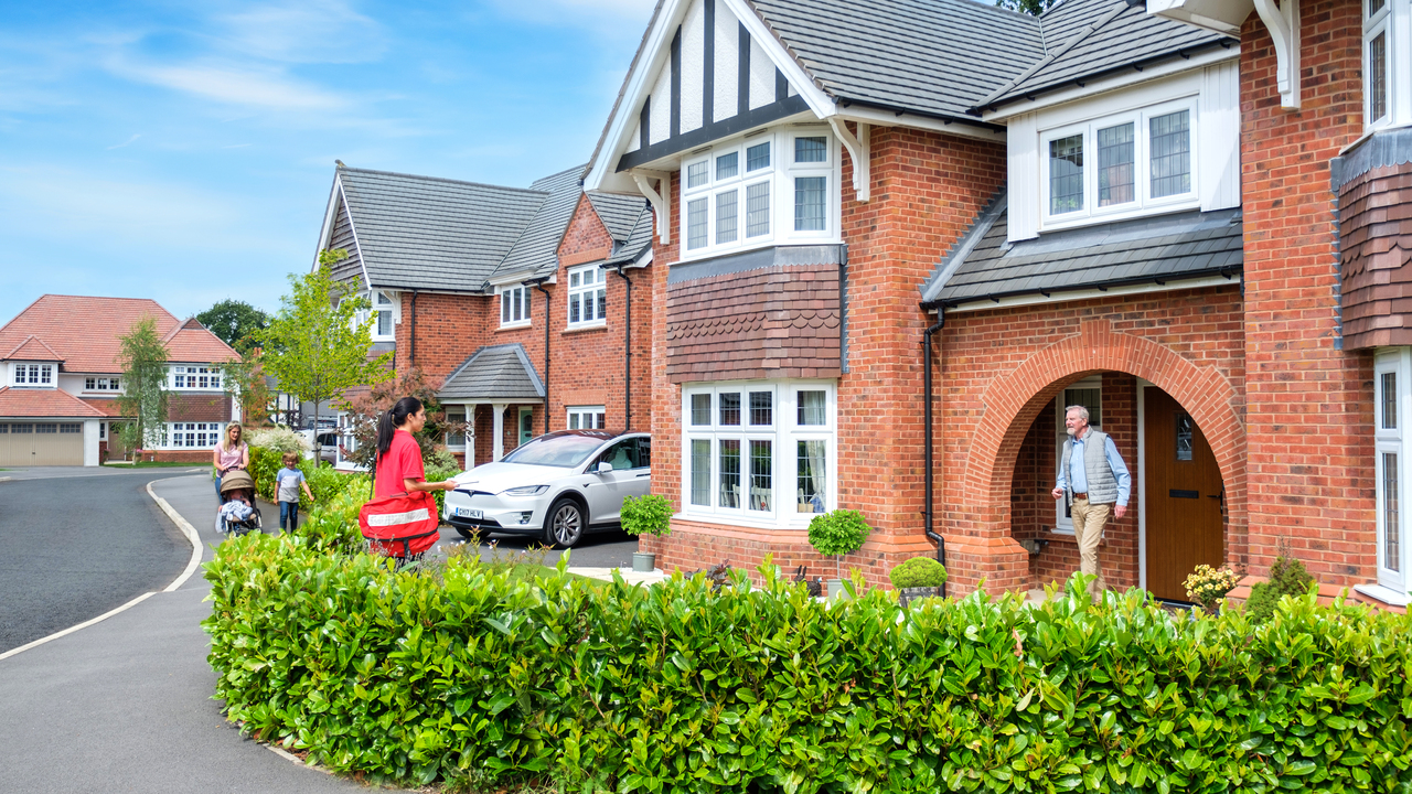 Man greeting postwomen at Blenheim home