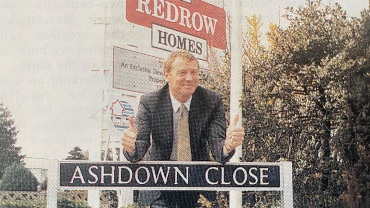 Paddy Ashdown with a street sign saying Ashdown Close