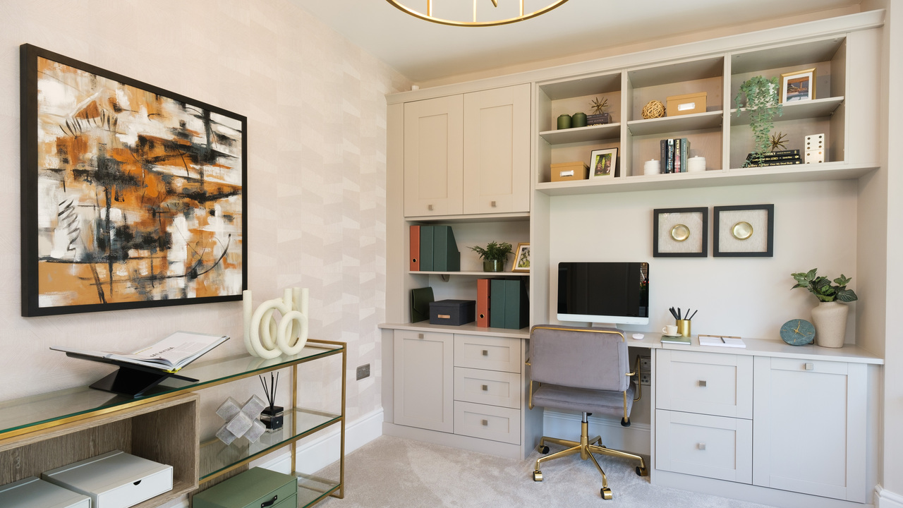 Sophisticated home office with fitted desk and storage