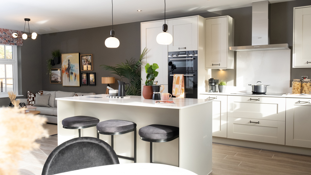 Open plan kitchen dining and family area decorated in a classic style