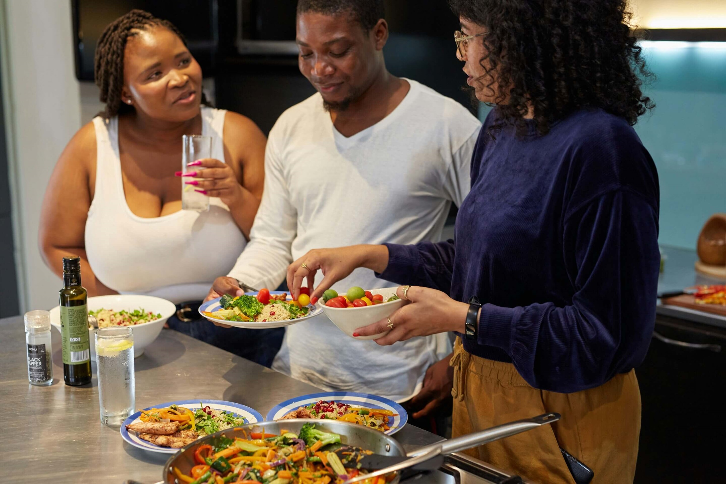 Group of friends at home eating snacks